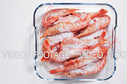 Time-lapse defrost shrimp top view