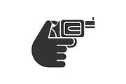 Hand holding revolver glyph icon