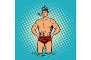 Retro diver lifeguard male in swimming trunks and mask