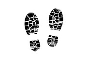 Footprints and shoeprints icon in black and white showing bare feet and the imprint of the soles with patterns of male and female footwear. Shoes boots imprint