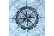 Grunge blue background with compass rose