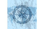 Compass rose on background of world map