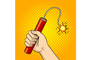 Hand with dynamite pop art vector illustration