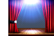 A theater stage with a red curtain 