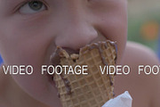 Boy eating chocolate ice cream cone