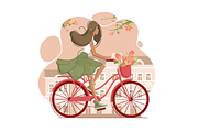 Girl on vintage bicycle with flowers