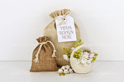 Bags with empty tag mockup, flowers