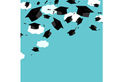 Graduate caps on the blue sky background