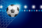 Soccer ball in goal with spotlight