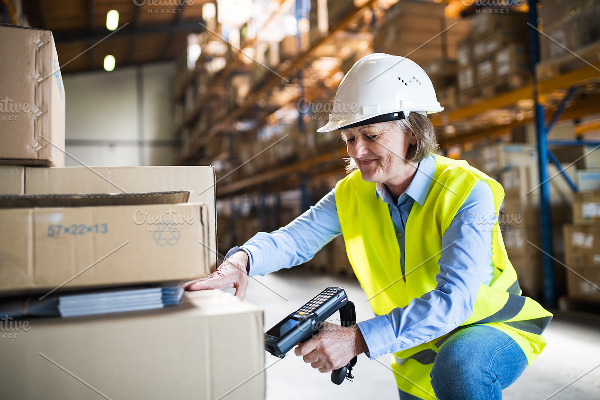 Senior warehouse woman worker working with barcode scanner. in Graphics - product preview 8