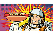 Smiling male astronaut presents hot dog sausage