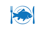 Fish on plate with fork and knife