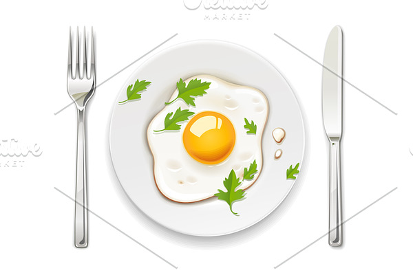 Scrambled eggs. Plate, fork and knife.
