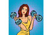beautiful woman with dumbbells in