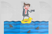 Businessman on a float on the sea