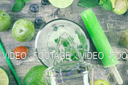 Slow motion fruit drink with ice top