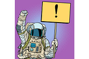 Astronaut protests with a poster