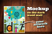 Mockup on the dark wood wall