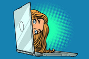 woman peeking out of laptop