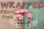 Wrapped in ribbon sketch font