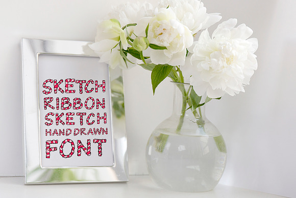 Wrapped in ribbon sketch font in Script Fonts - product preview 1