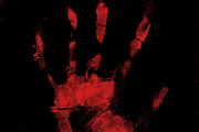 Scary bloody hand print on black