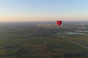 Hot air balloon shape heart in sky