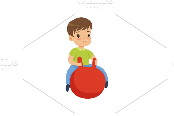 Cute little boy bouncing on red