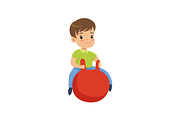 Cute little boy bouncing on red