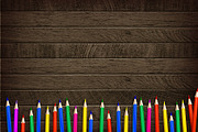 Color pencil on wooden background