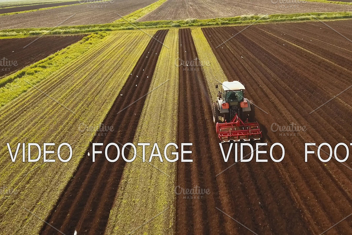 Tractor cultivates the land in the in Graphics - product preview 8