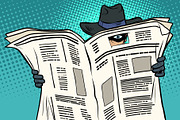 spy watches through the newspaper