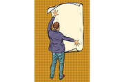 man unfolded poster paper