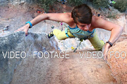 woman rock climber climbing on the