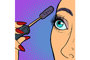 Woman paints eyelashes, makeup