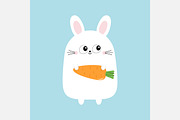 White bunny rabbit holding carrot.