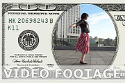 Woman is dancing in 100 dollar bill