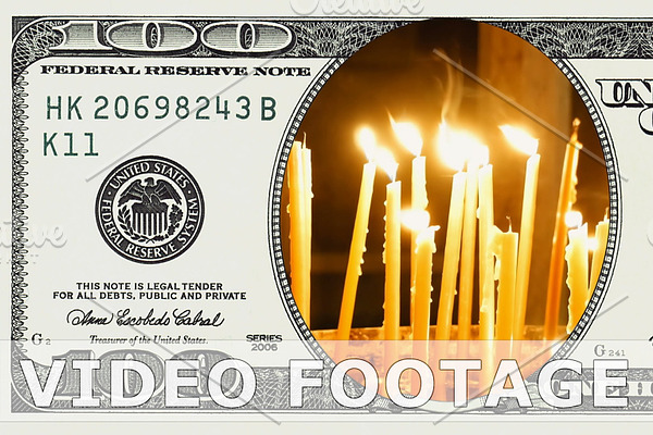 Burning candles in 100 dollar bill