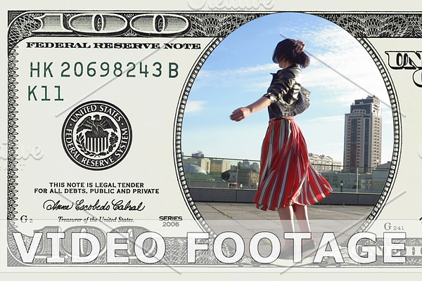 Woman is dancing in 100 dollar bill