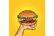 Burger on hand. fast food