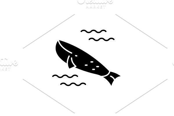 Whale in the ocean black icon