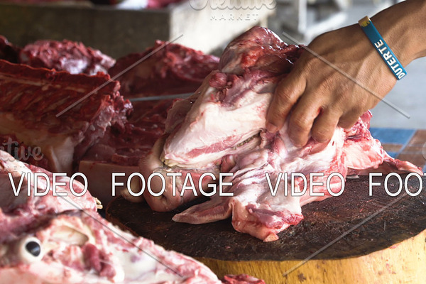 Cutting Meat at a street market.