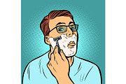 man shaving razors