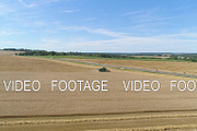 Combine harvester on wheat field