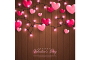 Valentine hearts and lights on wood