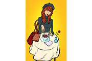 Red haired girl in a cafe