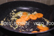 frying vegetables in a pan