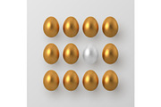 3d metallic golden and white eggs.