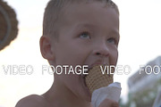 Kid enjoying chocolate ice cream