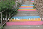 Walking colourful stairs up the hill